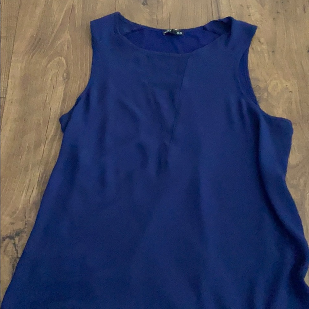 Tank with sheer cut out